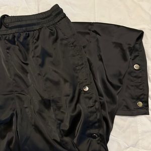 Fashion Nova tear away silk material pants.